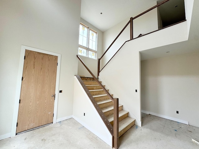 17970 103rd Ave N, Maple Grove, MN 55311 - stairs with a towering ceiling and baseboards