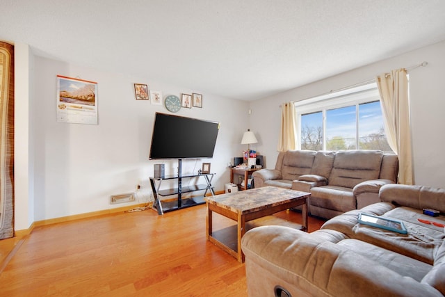 living area with light wood-style flooring