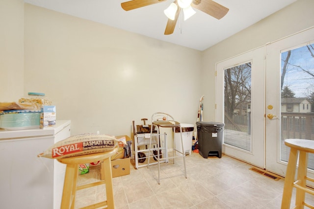 recreation room featuring a ceiling fan and light tile patterned flooring