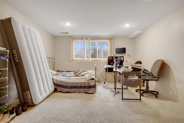 carpeted bedroom featuring recessed lighting and a desk