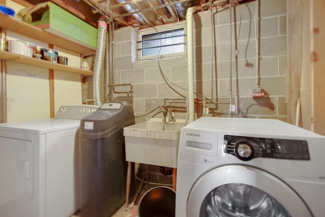 clothes washing area with washer and dryer