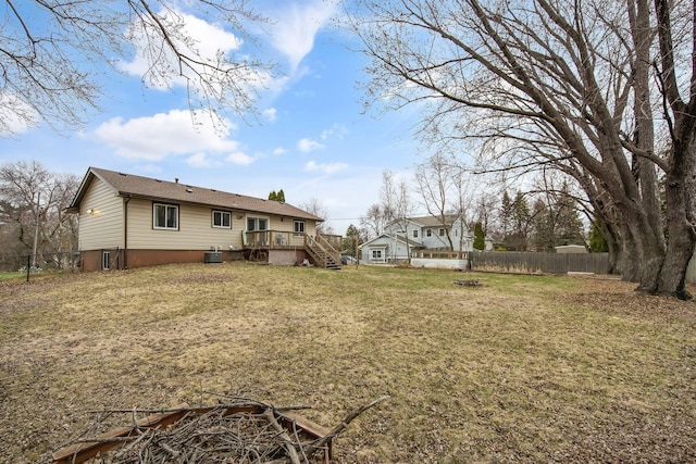 view of yard with a deck, stairway, and cooling unit