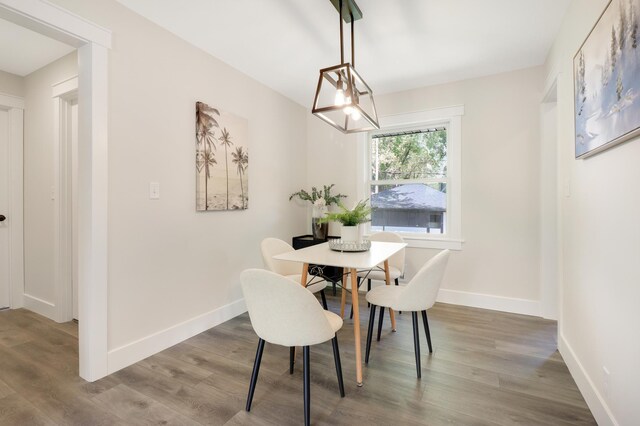 dining room with wood finished floors and baseboards