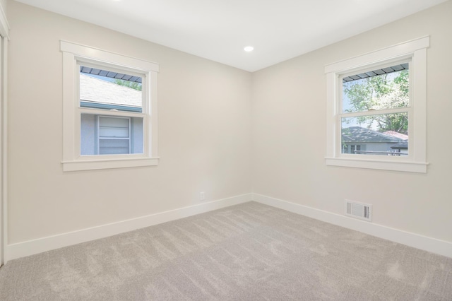 unfurnished room featuring carpet, baseboards, and recessed lighting