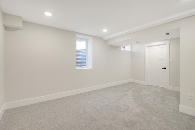 basement with carpet floors, baseboards, healthy amount of natural light, and recessed lighting