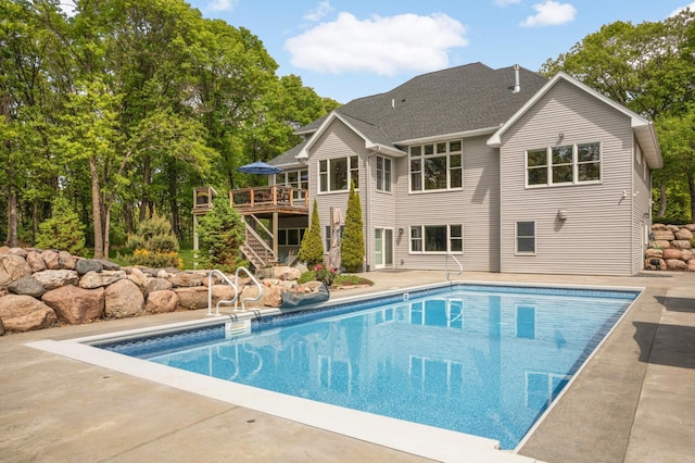 14575 268th Ave NW, Zimmerman, MN 55398 - outdoor pool with stairway, a wooden deck, and a patio area