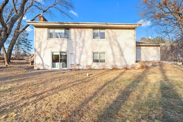 2622 159th Ave NE, Ham Lake, MN 55304 - rear view of property featuring a chimney and a lawn