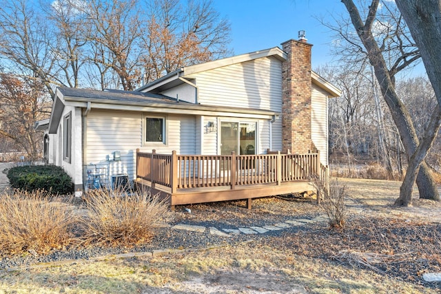 2622 159th Ave NE, Ham Lake, MN 55304 - back of house with a chimney and a deck
