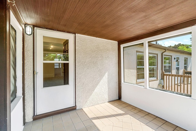 2216 57th St, Minneapolis, MN 55419 - unfurnished sunroom with a textured wall, wood ceiling, and tile patterned floors