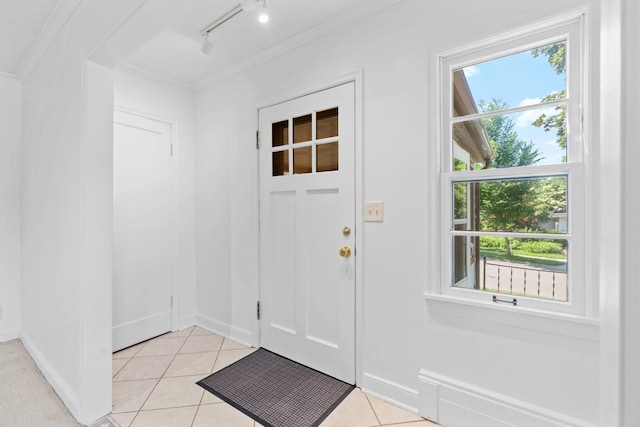 2216 57th St, Minneapolis, MN 55419 - doorway to outside featuring crown molding, rail lighting, and light tile patterned flooring