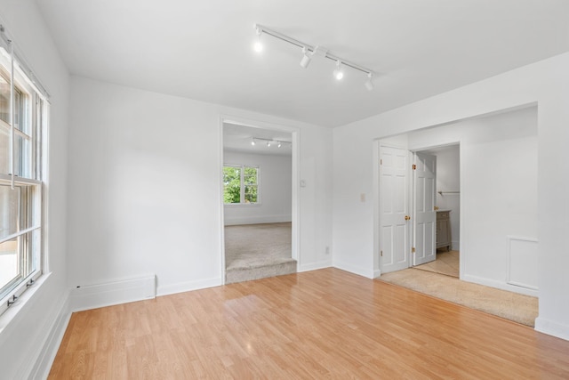2216 57th St, Minneapolis, MN 55419 - empty room with track lighting and light wood-type flooring
