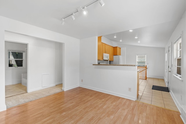 2216 57th St, Minneapolis, MN 55419 - unfurnished living room featuring light wood-type flooring, recessed lighting, and track lighting