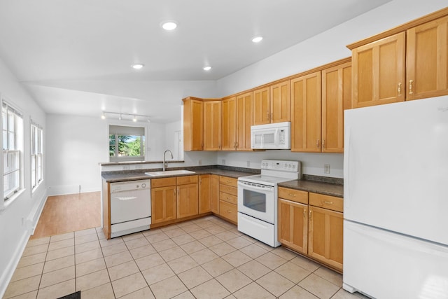 2216 57th St, Minneapolis, MN 55419 - kitchen with white appliances, dark countertops, a peninsula, light tile patterned flooring, and recessed lighting