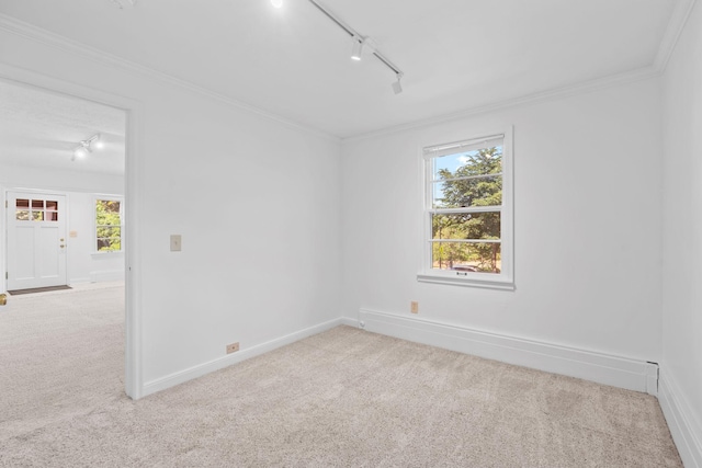 2216 57th St, Minneapolis, MN 55419 - carpeted empty room with track lighting, plenty of natural light, and crown molding
