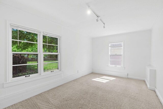 2216 57th St, Minneapolis, MN 55419 - carpeted empty room featuring rail lighting and baseboards