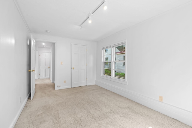 2216 57th St, Minneapolis, MN 55419 - unfurnished bedroom featuring light colored carpet and track lighting