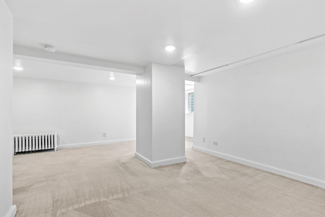 2216 57th St, Minneapolis, MN 55419 - below grade area with radiator heating unit, carpet floors, and recessed lighting