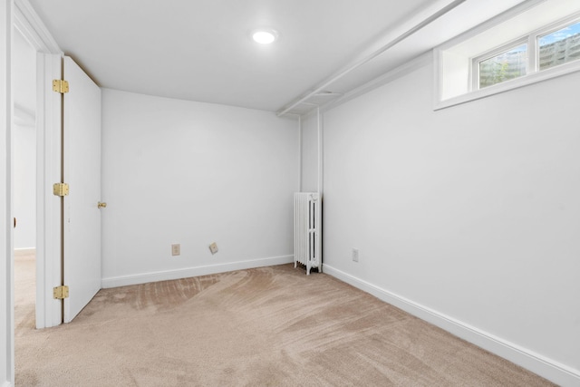 2216 57th St, Minneapolis, MN 55419 - below grade area featuring radiator heating unit and carpet floors