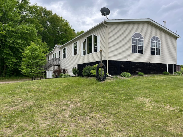 1141 Mahogany St, Mora, MN 55051 - view of side of home with a lawn