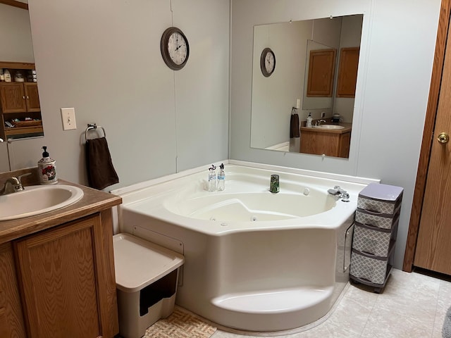 1141 Mahogany St, Mora, MN 55051 - bathroom with vanity, a whirlpool tub, and tile patterned floors