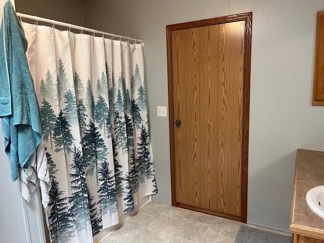 1141 Mahogany St, Mora, MN 55051 - bathroom with vanity and a shower with curtain