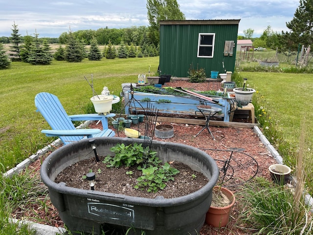 1141 Mahogany St, Mora, MN 55051 - view of green lawn with an outbuilding