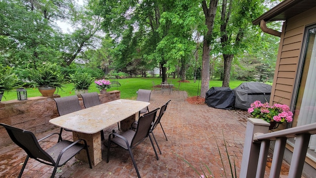 17473 Fairway Cir, Cold Spring, MN 56320 - view of patio / terrace featuring outdoor dining space, a grill, and view of wooded area