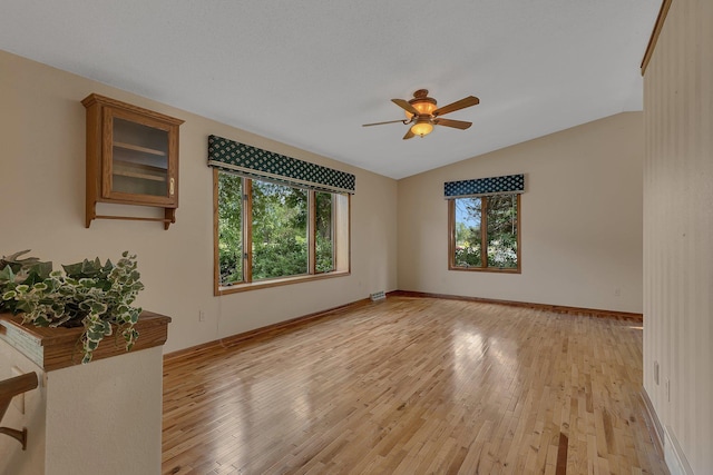 17473 Fairway Cir, Cold Spring, MN 56320 - spare room featuring lofted ceiling, a ceiling fan, and light wood-style floors