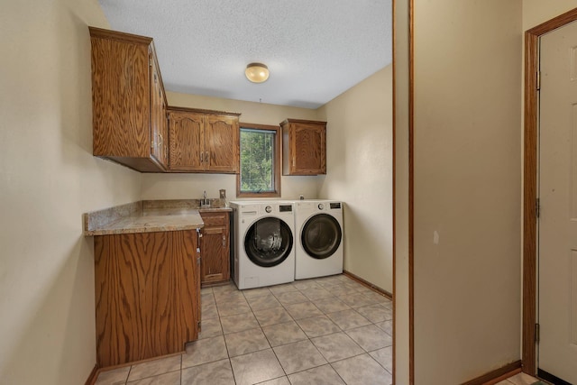 17473 Fairway Cir, Cold Spring, MN 56320 - laundry area featuring cabinet space, washing machine and clothes dryer, a textured ceiling, light tile patterned flooring, and bar