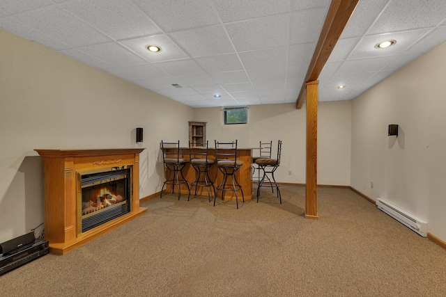 17473 Fairway Cir, Cold Spring, MN 56320 - dining area featuring a baseboard radiator, carpet, recessed lighting, bar area, and a glass covered fireplace