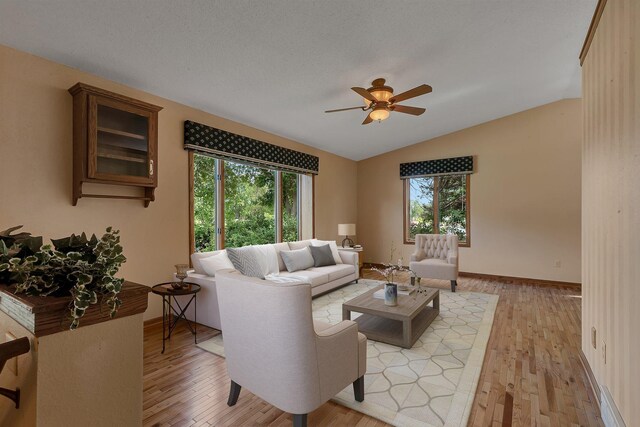 17473 Fairway Cir, Cold Spring, MN 56320 - living area featuring plenty of natural light, ceiling fan, lofted ceiling, and light wood finished floors