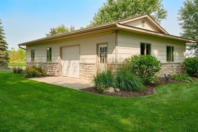 view of home's exterior featuring stone siding and a yard