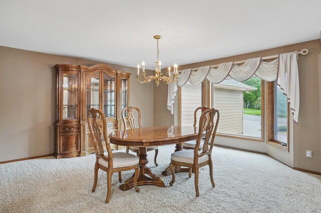 8681 144th Street Ct, Apple Valley, MN 55124 - carpeted dining area featuring a chandelier and baseboards