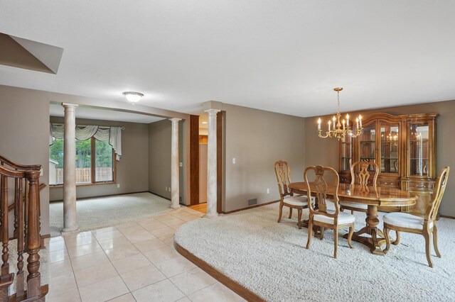 8681 144th Street Ct, Apple Valley, MN 55124 - dining room featuring light colored carpet, ornate columns, a chandelier, and baseboards
