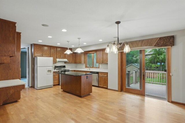 8681 144th Street Ct, Apple Valley, MN 55124 - kitchen featuring stainless steel appliances, ventilation hood, light wood-style flooring, recessed lighting, and a center island