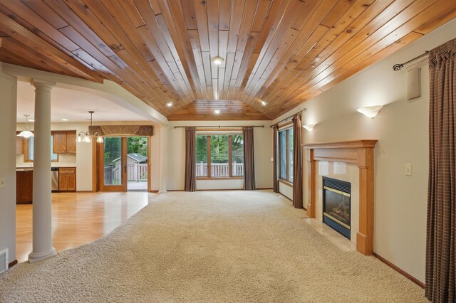 8681 144th Street Ct, Apple Valley, MN 55124 - unfurnished living room with light carpet, vaulted ceiling, wood ceiling, a fireplace, and baseboards