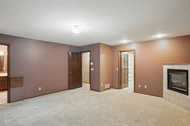 8681 144th Street Ct, Apple Valley, MN 55124 - unfurnished bedroom with carpet floors, a high end fireplace, baseboards, and connected bathroom