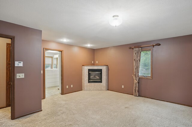 8681 144th Street Ct, Apple Valley, MN 55124 - unfurnished living room with a fireplace, carpet, and baseboards