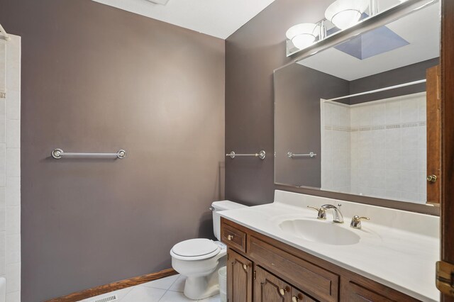 8681 144th Street Ct, Apple Valley, MN 55124 - full bath with tile patterned flooring, toilet, vanity, and a shower