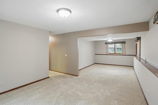 8681 144th Street Ct, Apple Valley, MN 55124 - spare room featuring carpet flooring, baseboards, and a textured ceiling