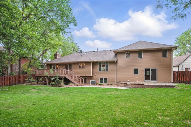 8681 144th Street Ct, Apple Valley, MN 55124 - back of property featuring stairway, central AC unit, a deck, a chimney, and a shingled roof