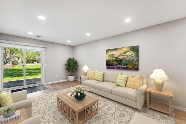 8754 Cottonwood Ln N, Maple Grove, MN 55369 - living area with light wood finished floors, recessed lighting, and baseboards