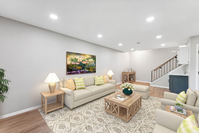 8754 Cottonwood Ln N, Maple Grove, MN 55369 - living room with stairs, light wood finished floors, baseboards, and recessed lighting