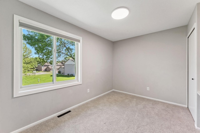 8754 Cottonwood Ln N, Maple Grove, MN 55369 - spare room featuring carpet floors and baseboards