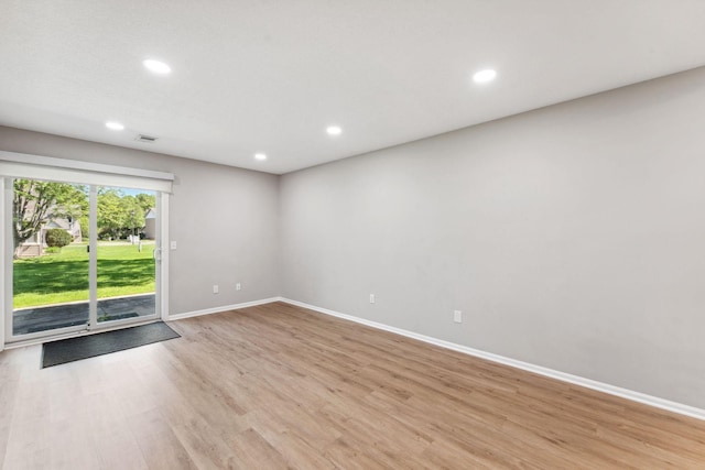 8754 Cottonwood Ln N, Maple Grove, MN 55369 - empty room featuring baseboards, light wood finished floors, and recessed lighting