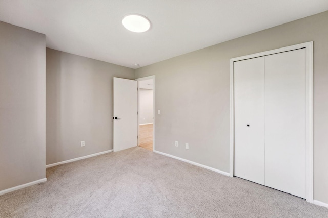 8754 Cottonwood Ln N, Maple Grove, MN 55369 - unfurnished bedroom featuring carpet, baseboards, and a closet