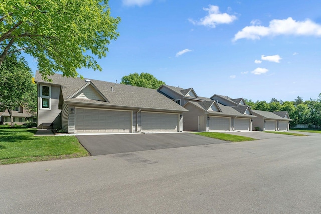 8754 Cottonwood Ln N, Maple Grove, MN 55369 - townhome / multi-family property with roof with shingles and a front yard