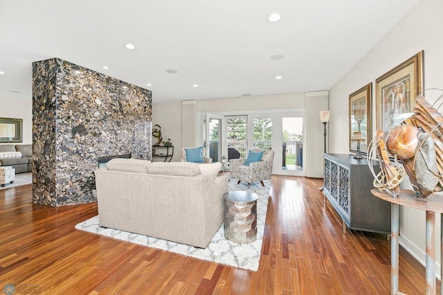 2501 30th Ave S Unit 201, Fargo, ND 58103 - living area with wood finished floors, a fireplace, and recessed lighting