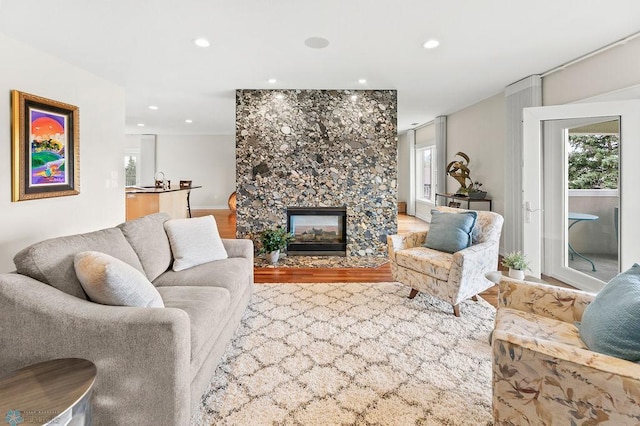 2501 30th Ave S Unit 201, Fargo, ND 58103 - living room featuring wood finished floors, a multi sided fireplace, and recessed lighting