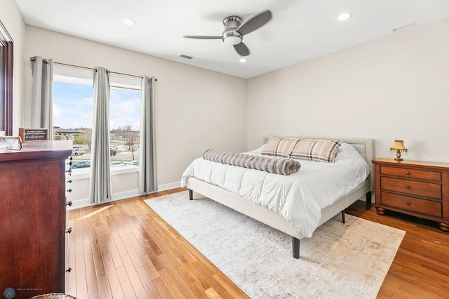 2501 30th Ave S Unit 201, Fargo, ND 58103 - bedroom featuring wood finished floors, recessed lighting, ceiling fan, and baseboards